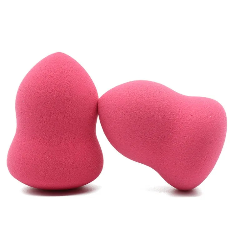 Pink non-latex makeup foundation sponge shown next to a ruler showing 4 cm width and 5.6 cm height