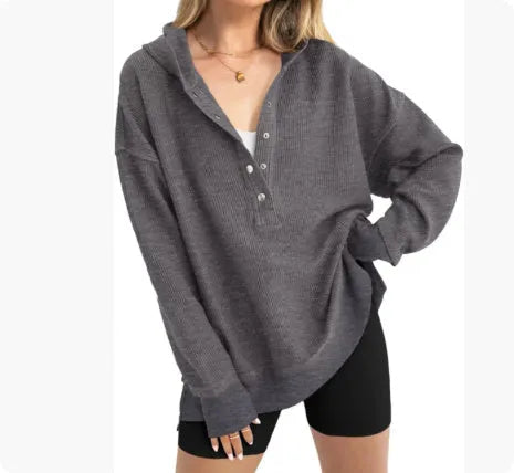 Women's loose fit raglan sleeve sweater in peacock green, shown on a model.