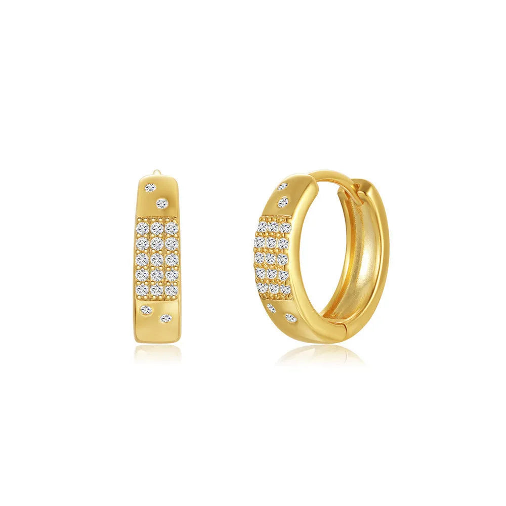 Golden brass earclip earrings with geometric round drop design on white background