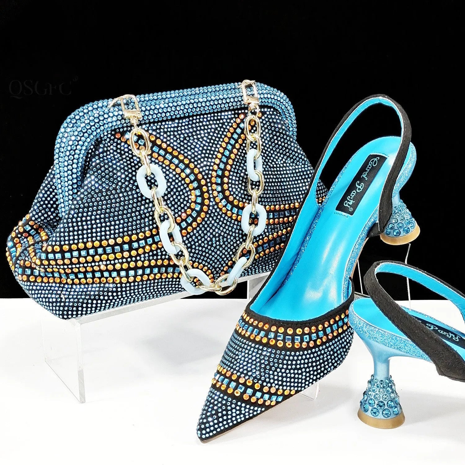 Women's pointed toe high heels with matching small bag, shown in a selected colour with a wine glass heel and rhinestone detail.