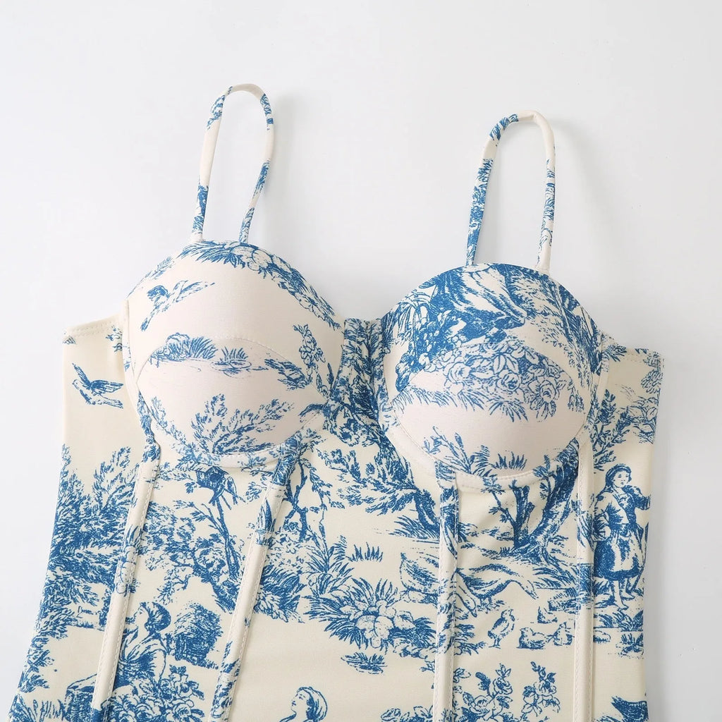 Blue patterned one-piece swimsuit for women shown with an optional matching gauze skirt.