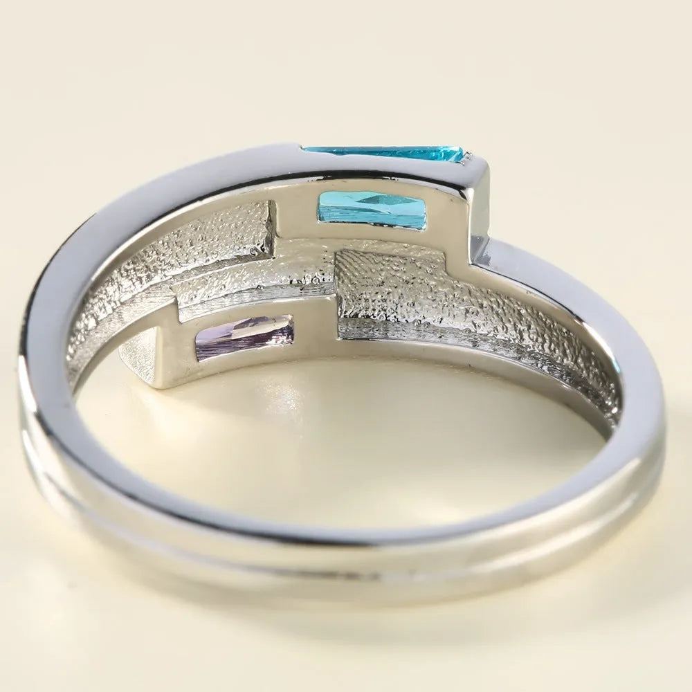 Silver-coloured copper ring with a zircon stone inlay, shown in ins style.