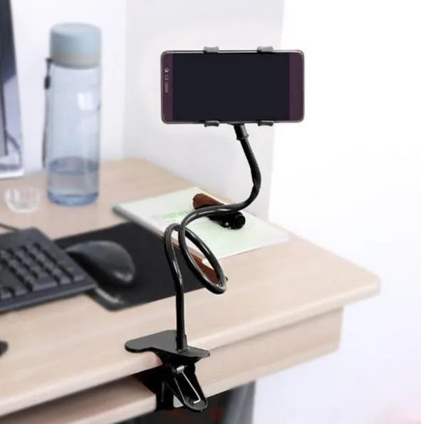 Black portable mobile phone holder with a long flexible arm and a V-clip, extended on a surface.