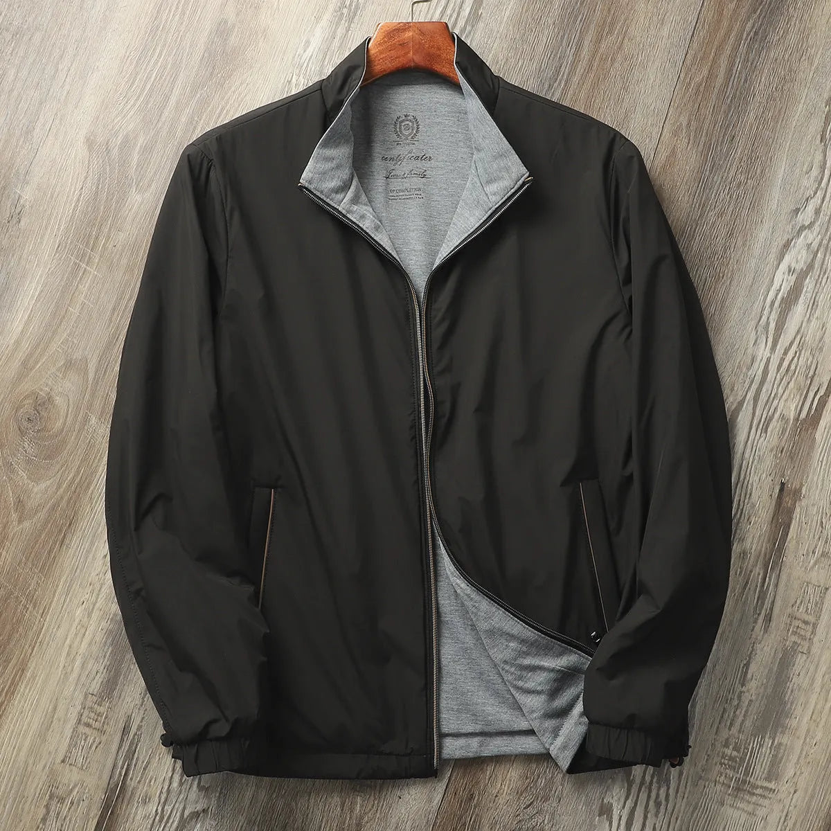 Men's simple stand collar casual jacket in polyester blend fabric, shown on a hanger.