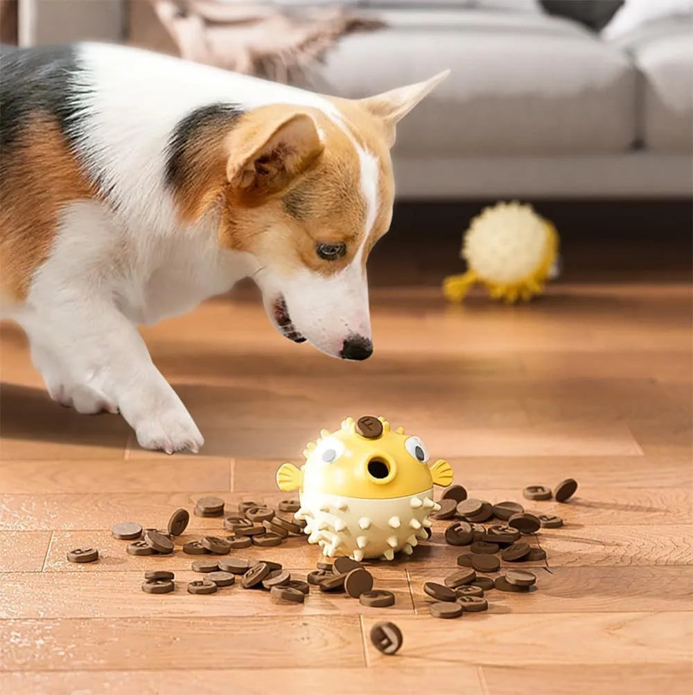 Green fish-shaped dog toy with textured surface for dental cleaning and treat dispensing