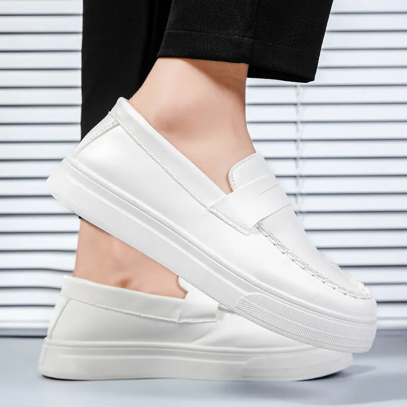Men's white PU leather slip-on loafers with round toe on a solid background.
