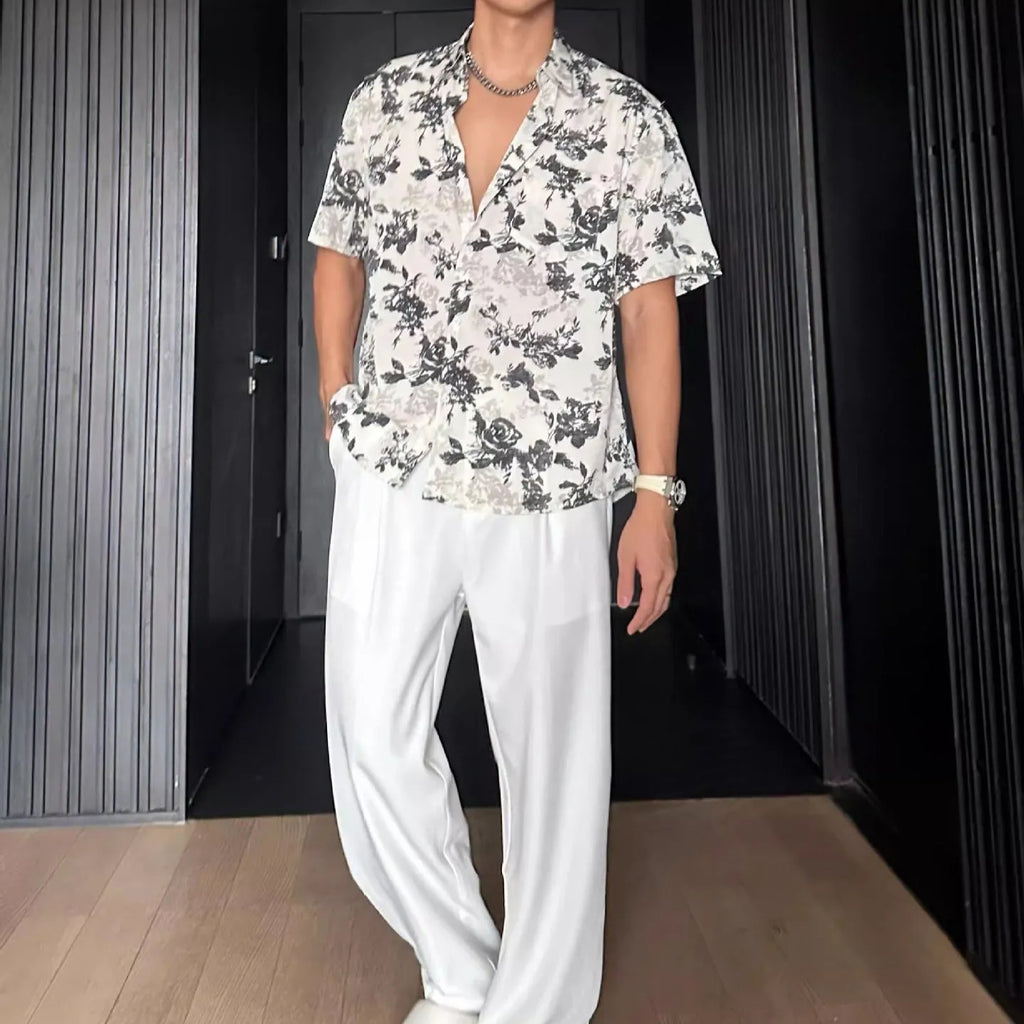 Loose casual short sleeve shirt with floral printed pattern and V-neck design in white colour
