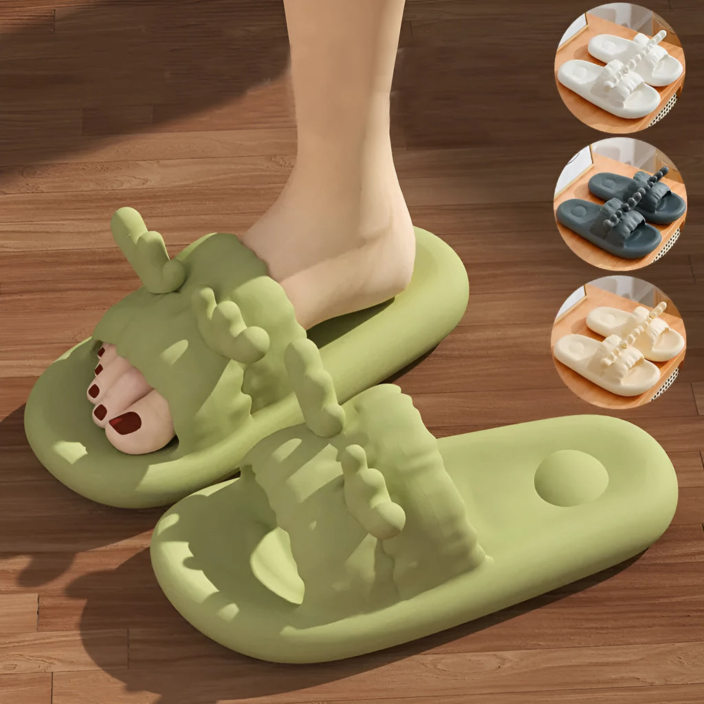 Light grey EVA flip flop slippers with a deer horn design and hollow out pattern on the upper.