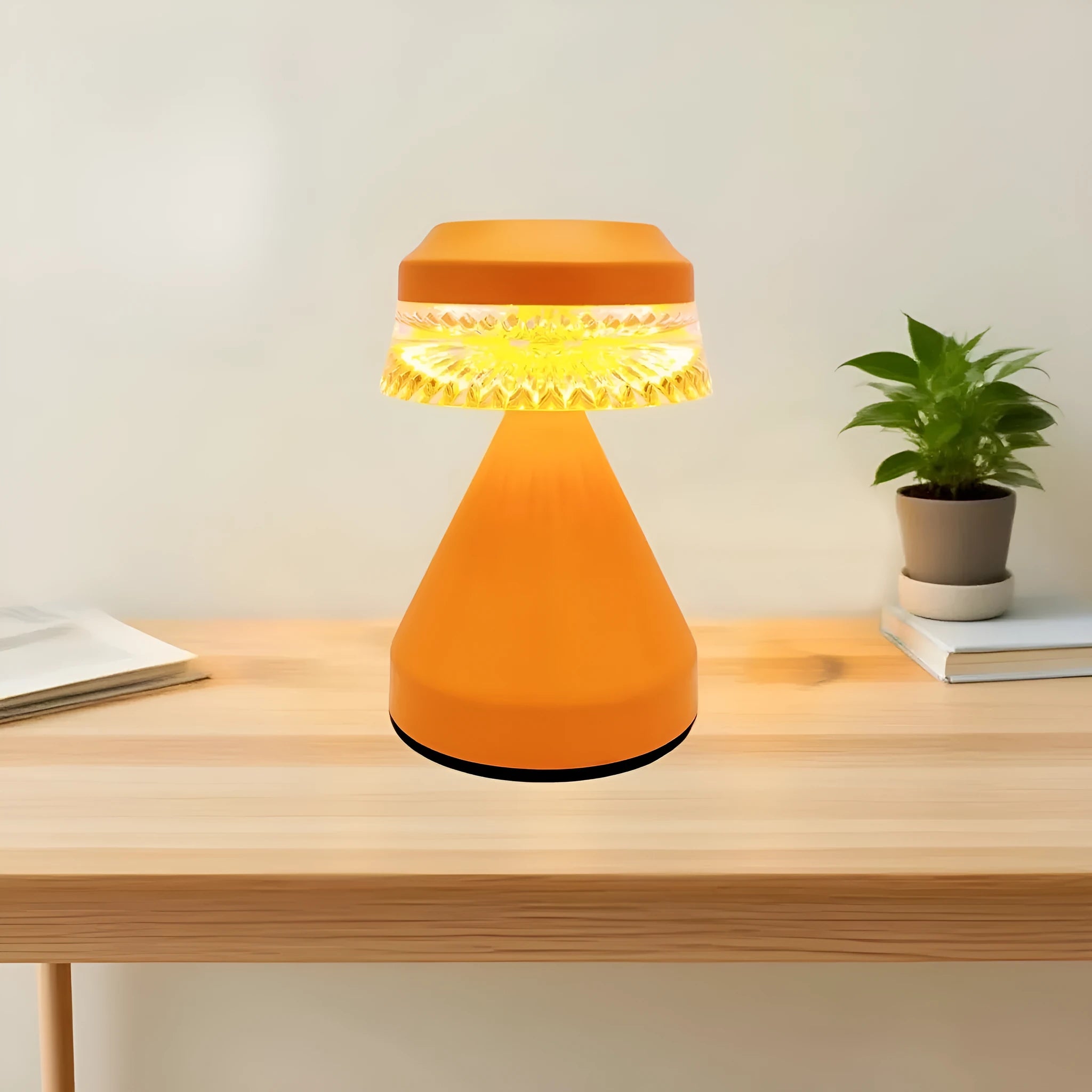 Small luxury style LED night lamp in orange with USB cable for charging.