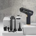 Black wireless car vacuum cleaner with accessories including brush heads and nozzles for vehicle interior cleaning