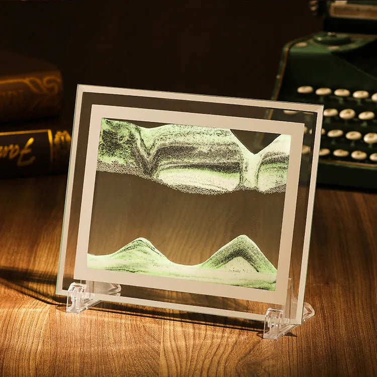 Geometric glass ornament with colourful quicksand painting inside, shown in black and white green colour variant.