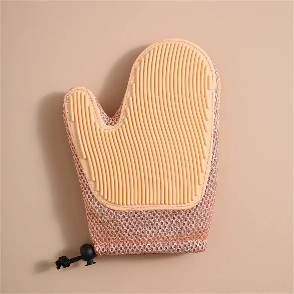 Dark blue mesh and TPR pet grooming glove for removing dog and cat hair from fur and fabrics.