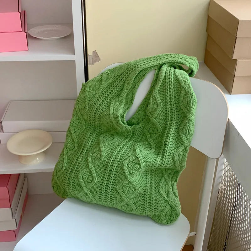 Knitted wool yarn shoulder tote bag with hollow crochet design in solid colour