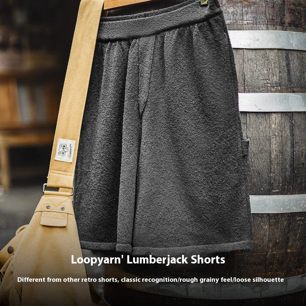Cement grey polyester sports shorts with straight cut and fifth pants length on mannequin