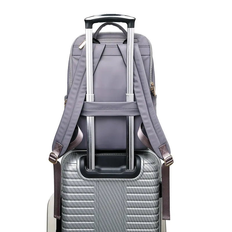 Large capacity women's Oxford cloth backpack in black and grey colours showing waterproof anti-theft design