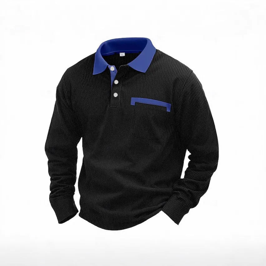Man wearing a long-sleeve waffle-texture polo shirt in a loose retro fit, showing asymmetric design detail.