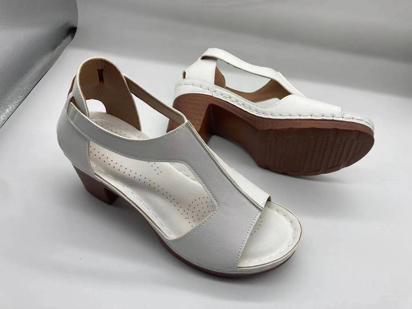 Women's white peep toe wedge sandals with Roman style buckle and low heel