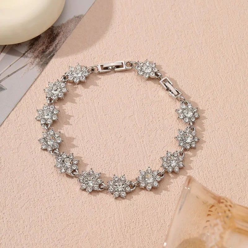 Gold and silver electroplated flower bracelet with coloured gemstone accents on zinc alloy