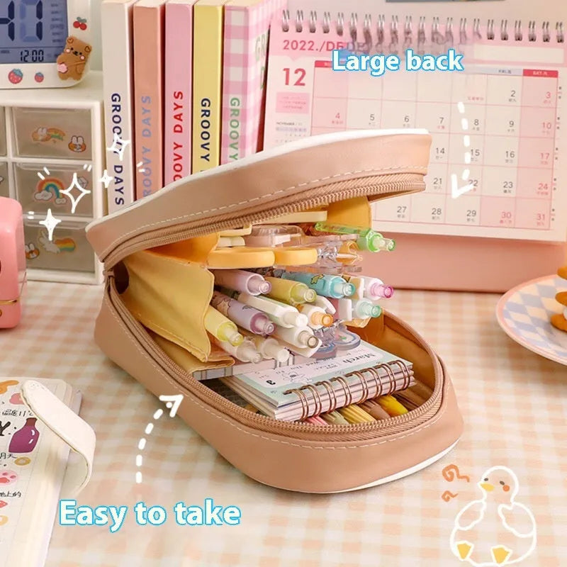 Transparent PVC pencil case with cartoon pattern, showing large capacity design for stationery storage