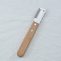 Pet stripping comb with wood handle and metal teeth for grooming long-haired dogs and cats.