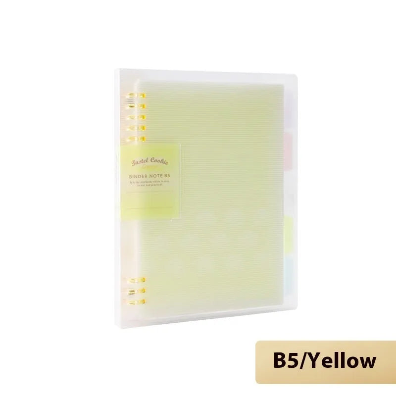 Refillable loose-leaf spiral notebook with PP cover open, showing raw wood pulp paper in grid ruling.