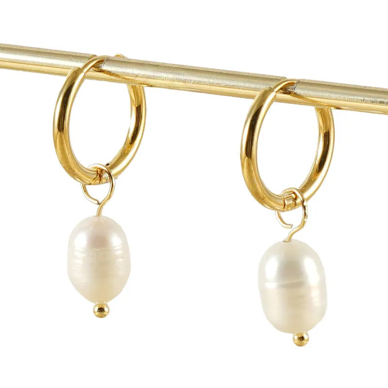 Gold geometric drop earrings for women with a pearl detail on a stainless steel base.
