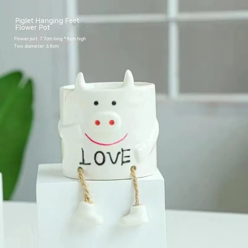 Ceramic hanging foot flowerpot with cartoon design for succulent plants on desktop