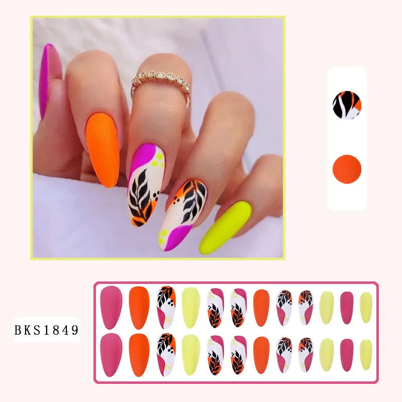 Four boxes of almond-shaped frosted nail stickers showing French leaves, leopard print, macaron and plating designs with tulip pattern