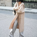 Long grey knitted cardigan hooded trench coat with splicing detail on mannequin