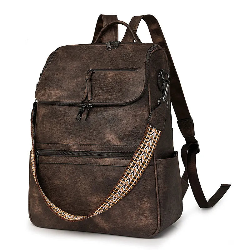 Retro college student backpack in PU leather with curved shoulder straps showing stitching detail