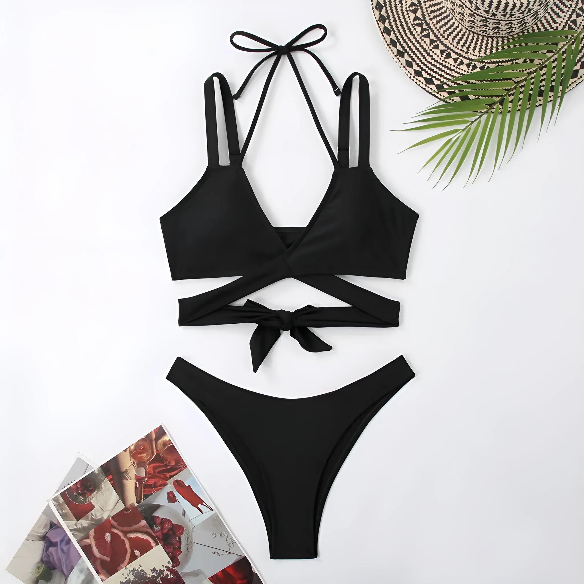 Women's solid colour bikini swimsuit on a hanger, showing adjustable straps and briefs style.