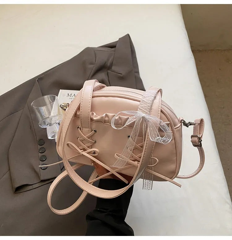 Women's casual PU shoulder handbag with a bandage bow and phone compartment in multiple colour options.