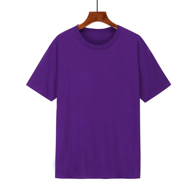 Man wearing a black loose-fit cotton T-shirt, short sleeves, crew neck.