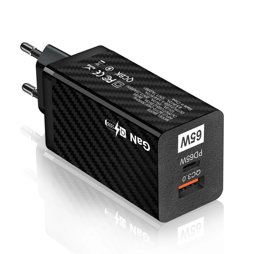 White and black 65W Gallium Nitride USB-PD laptop charger with EU, UK, and US plug options.