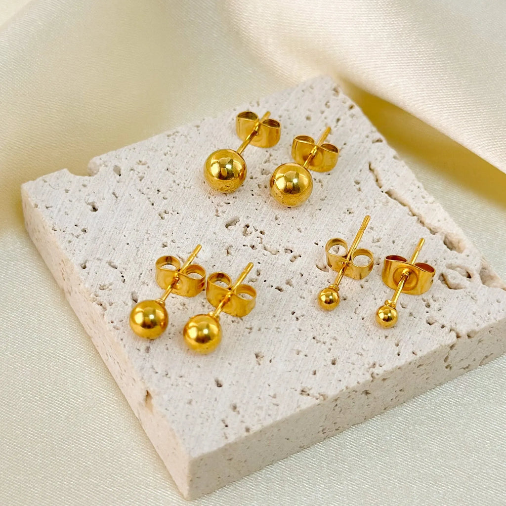 Stainless steel ball stud earrings with geometric round design in gold or silver electroplated finishes