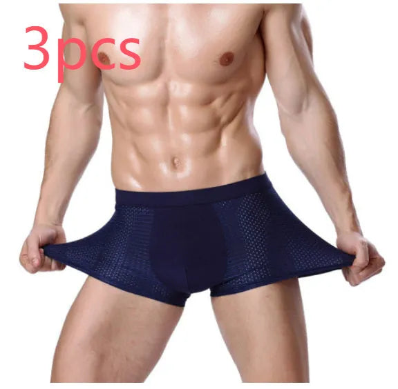 Men's solid colour modal boxer briefs with a U-convex design on a mid-waist.