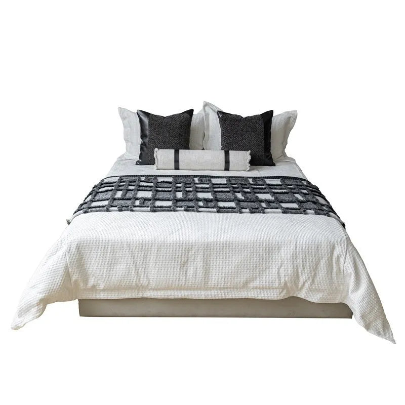 Modern minimalist grey and white plaid bed runner blanket set with pillow on bed