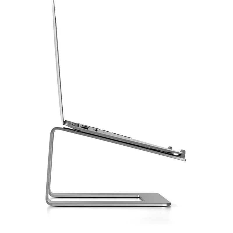 Black aluminium alloy laptop stand on a desk, elevating a silver laptop.