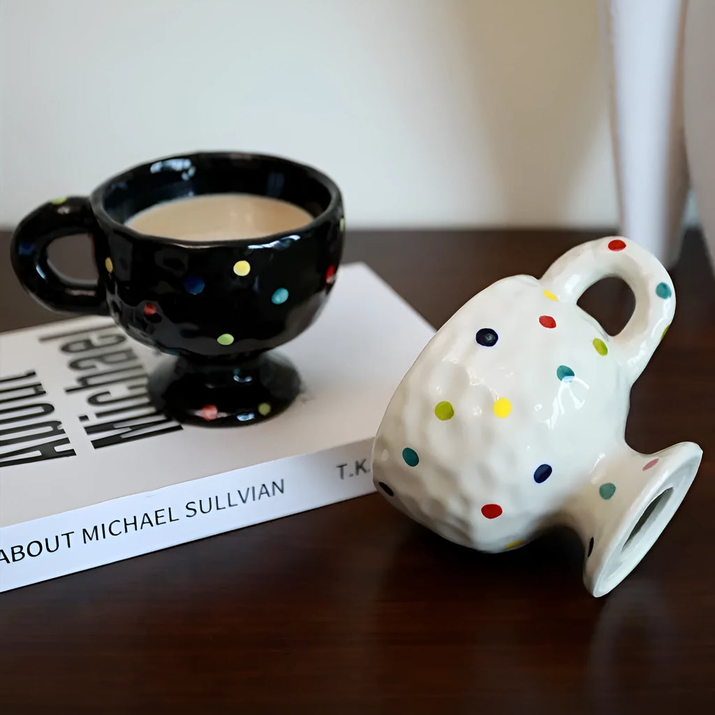 Handmade ceramic mug with irregular shape in solid colour