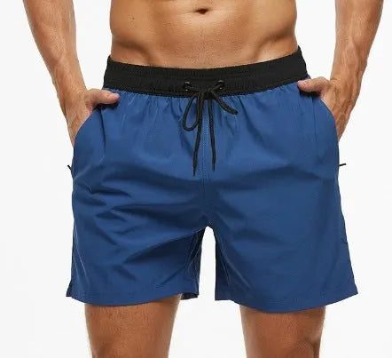 Men's blue running shorts with stitching waistband, zipper pocket, and drawstring for fitness activities