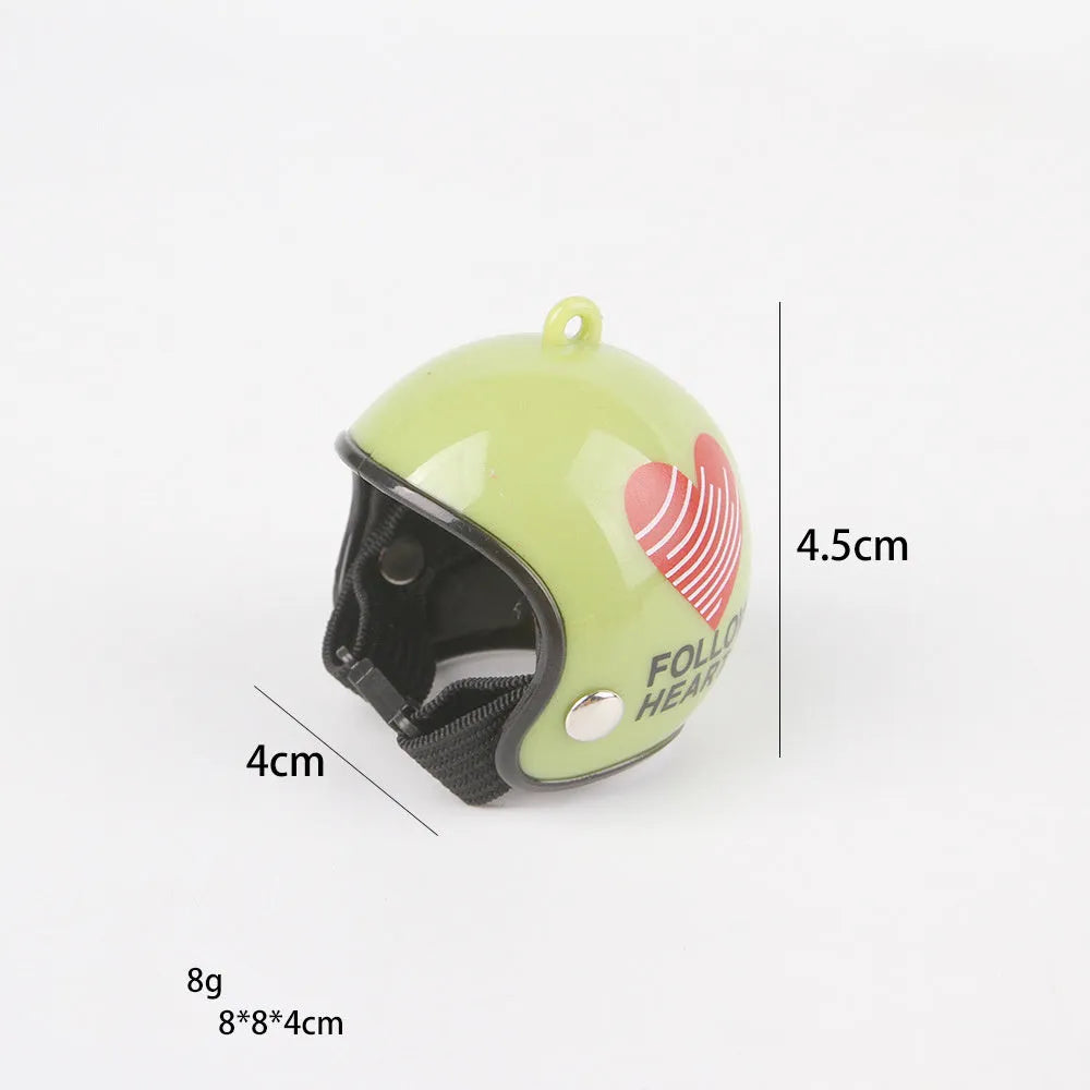 Small hard plastic helmet with elastic straps and sponge lining for a chicken or pet bird.