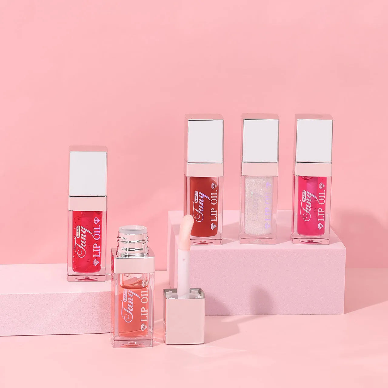 Five tubes of bright lip gloss mint lipstick in shades 001, 006, 007, 012, and 015.