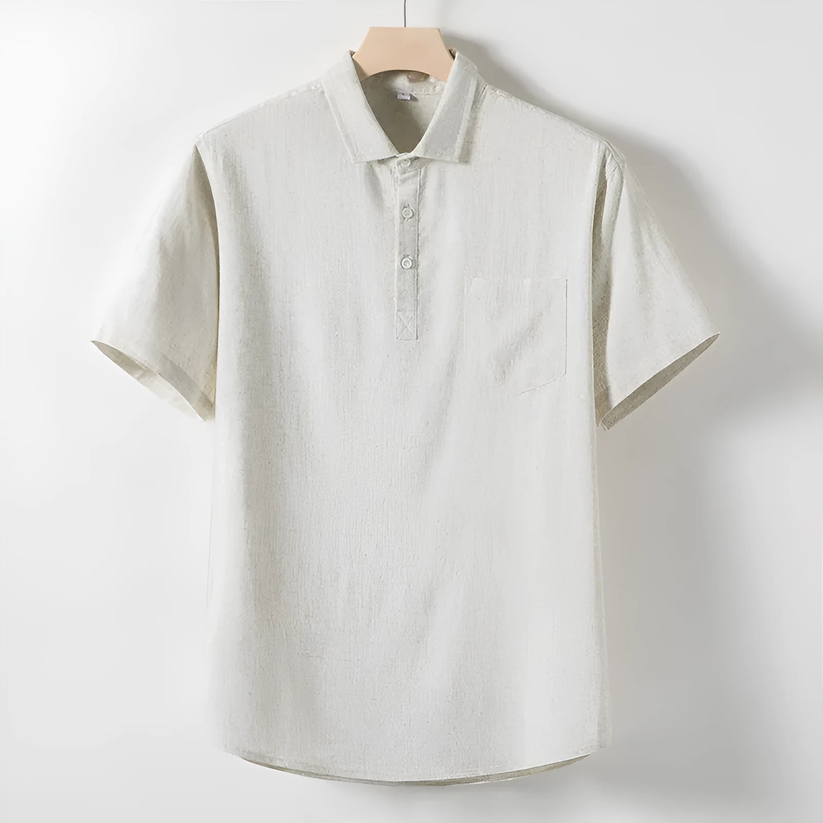 Men's loose-fitting linen-blend lapel t-shirt in black, shown on a model, highlighting the open collar and short sleeves.