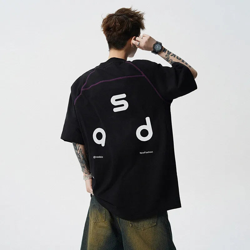 Loose fit black cotton t-shirt with a white letter print design on the front.