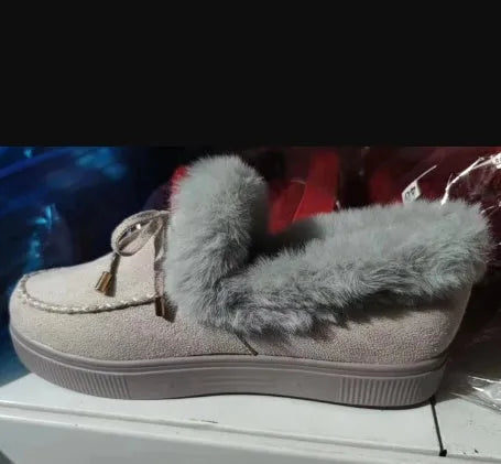 Women's white cotton house slippers with a round toe and non-slip rubber sole.