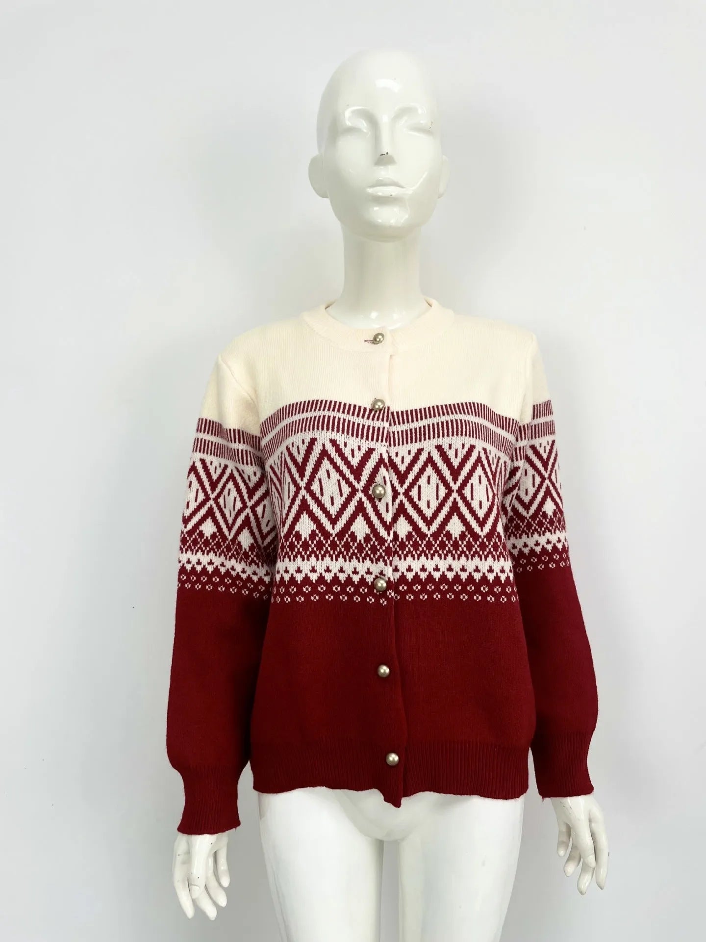 Women's grey alpaca wool cardigan with long sleeves and a red diamond contrast knit pattern.