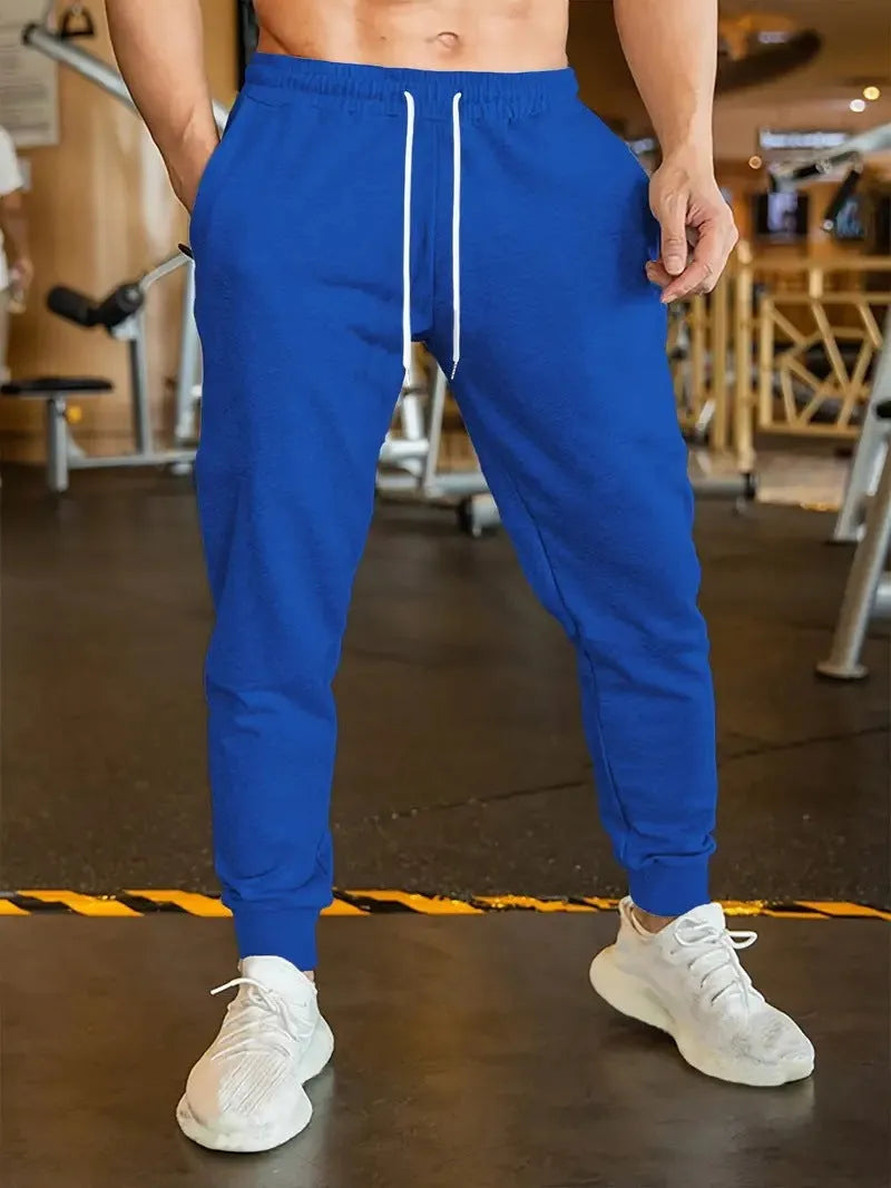 Men's linen-style leisure trousers with elastic drawstring waistband and loose fit design