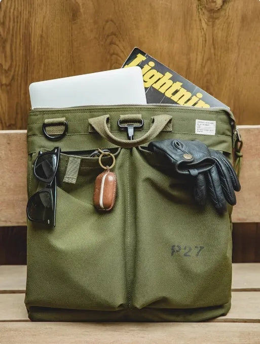 Canvas crossbody shoulder bag in military green with phone pocket and space for 15-inch laptop