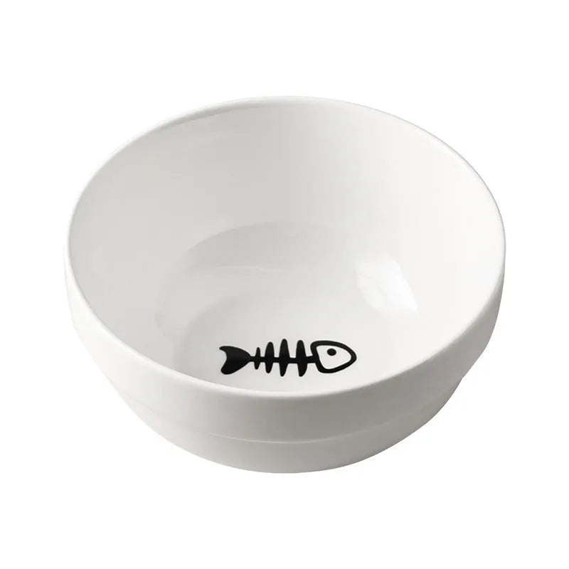 White ceramic cat bowl with decorative pattern sitting in a black iron frame stand.