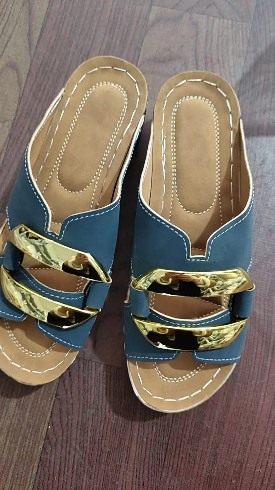 Roman style platform flip-flop sandals in white, black, khaki, and sea blue on a solid background